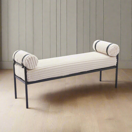 Decorative bench with white cushioned backrests and black metal frame on a white background