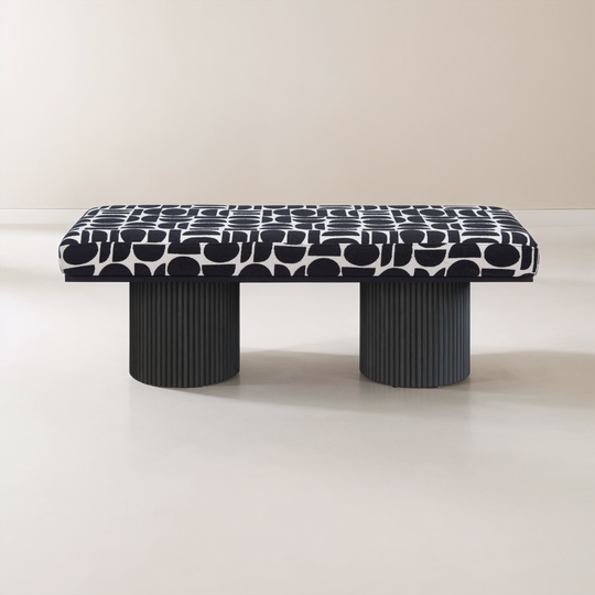 Black and white patterned bench on a plain background