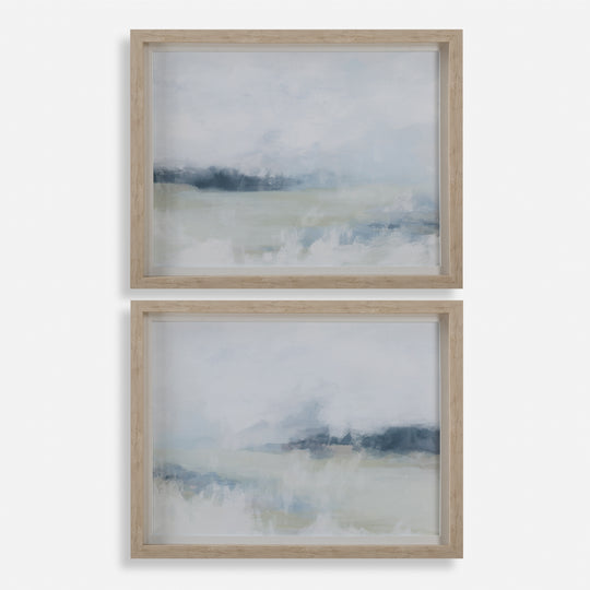 Two framed abstract artworks with a landscape theme on a white background