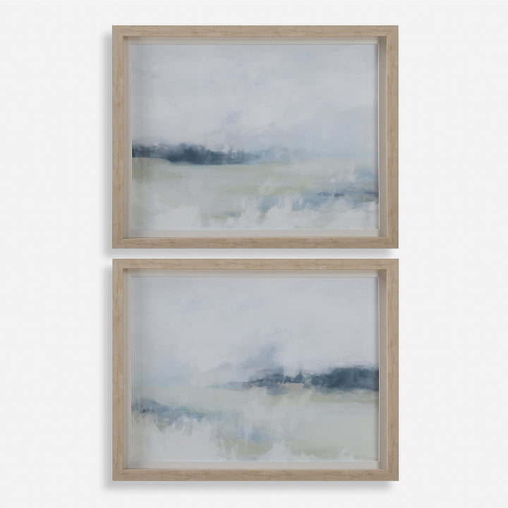 Two framed abstract artworks with a landscape theme on a white background