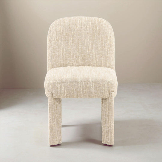 Beige upholstered chair on a plain background