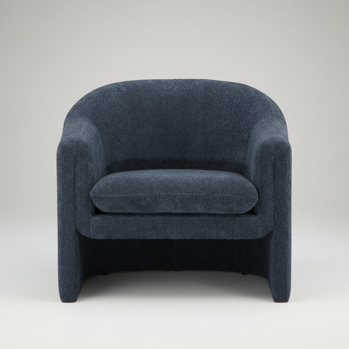 bouclé fabric armchair, rounded backrest and armrests, low-slung modern design, plush cushioned seat, seamless curved silhouette, minimalist aesthetic, studio white background, textured upholstery