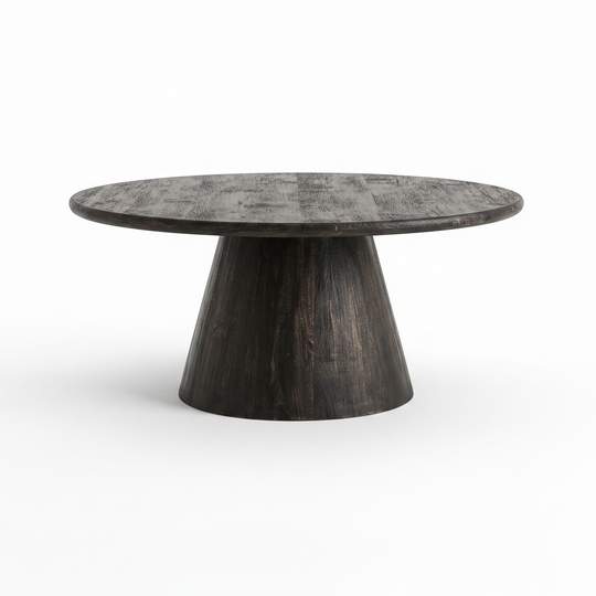 A round coffee table with a dark, distressed wood grain top and a tapered pedestal base, shown on a clean white background.