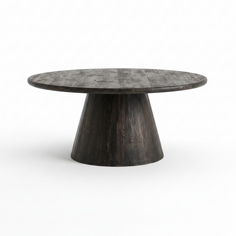 A round coffee table with a dark, distressed wood grain top and a tapered pedestal base, shown on a clean white background.
