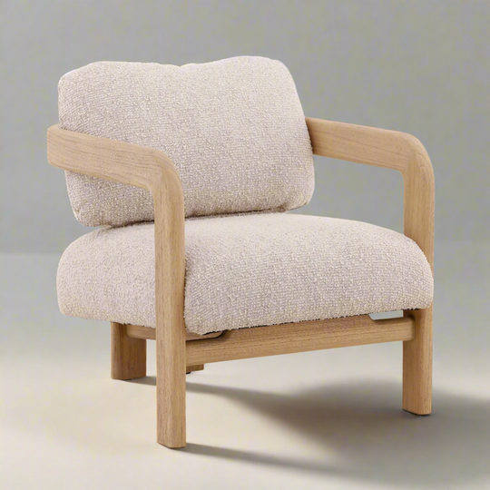 Beige armchair with wooden frame on a neutral background