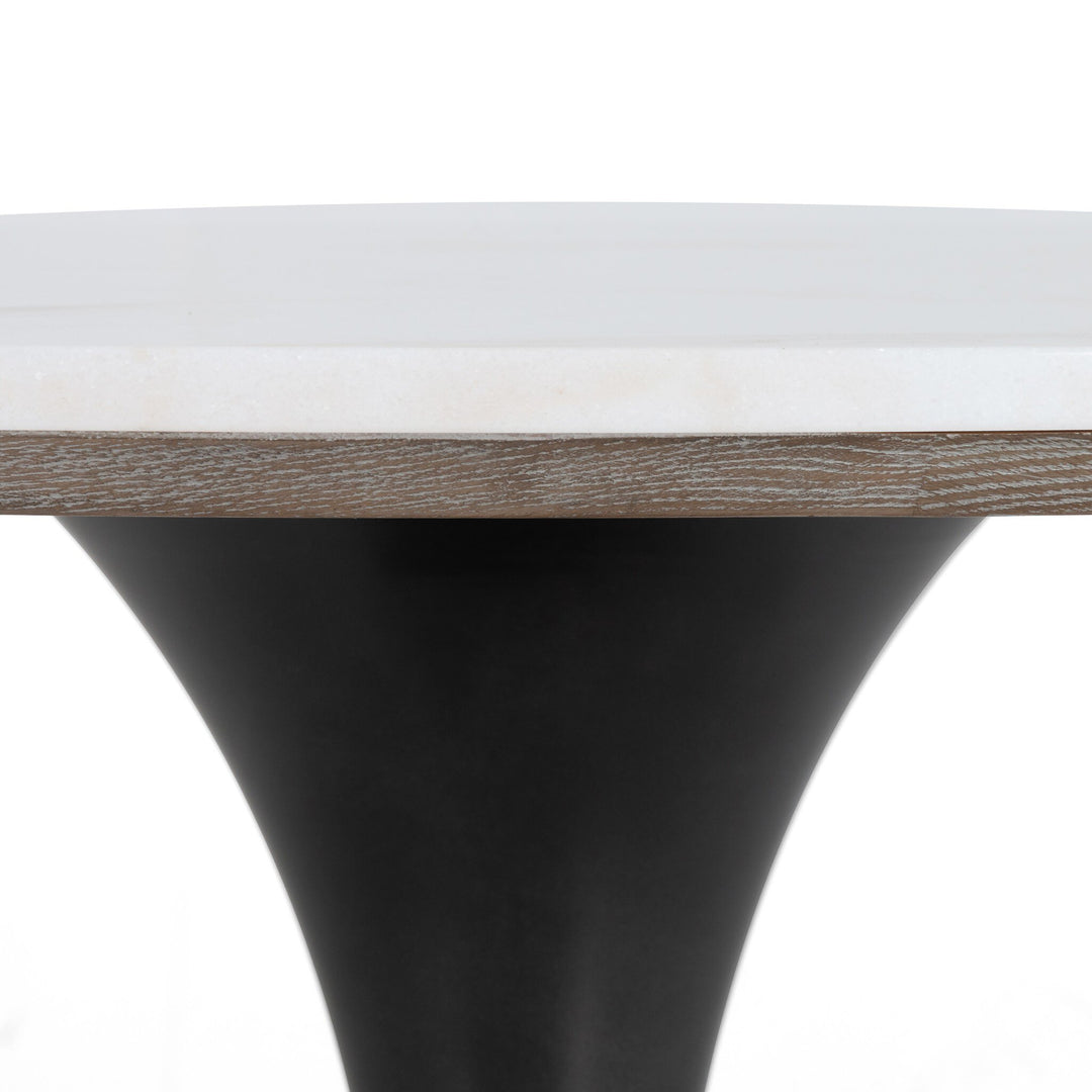 Close-up of a modern table showcasing a white marble top with a wooden edge and a sleek black cone-shaped base.