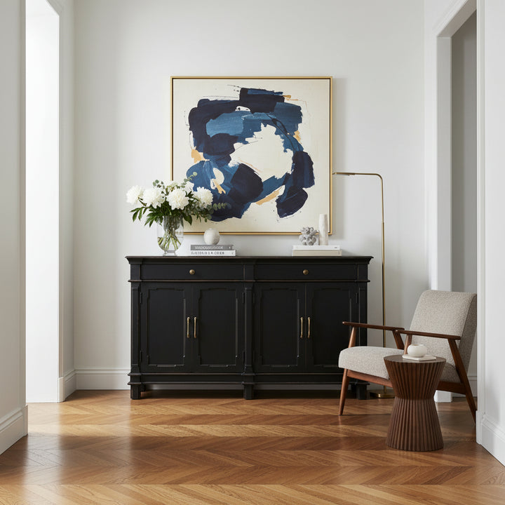 A distressed black wooden sideboard cabinet with brass handles and knobs, featuring two drawers on top and four doors below