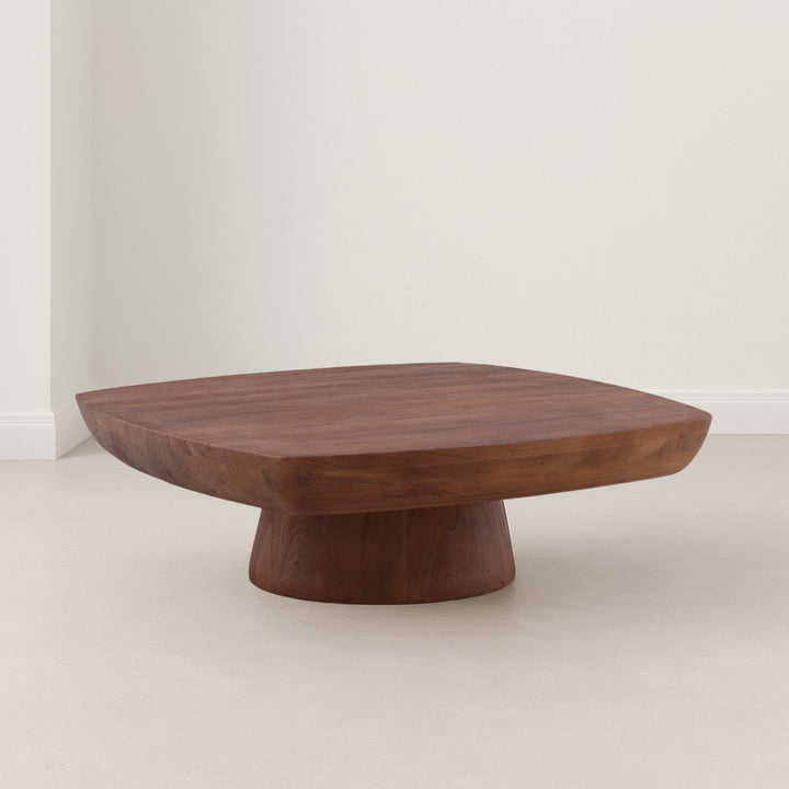 Wooden coffee table with a unique design on a plain background
