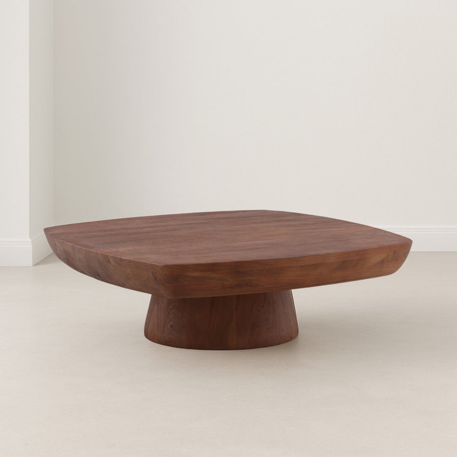 Wooden coffee table with a unique design on a plain background