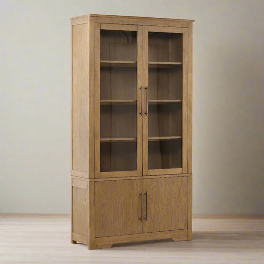 Wooden cabinet with glass doors on a white background