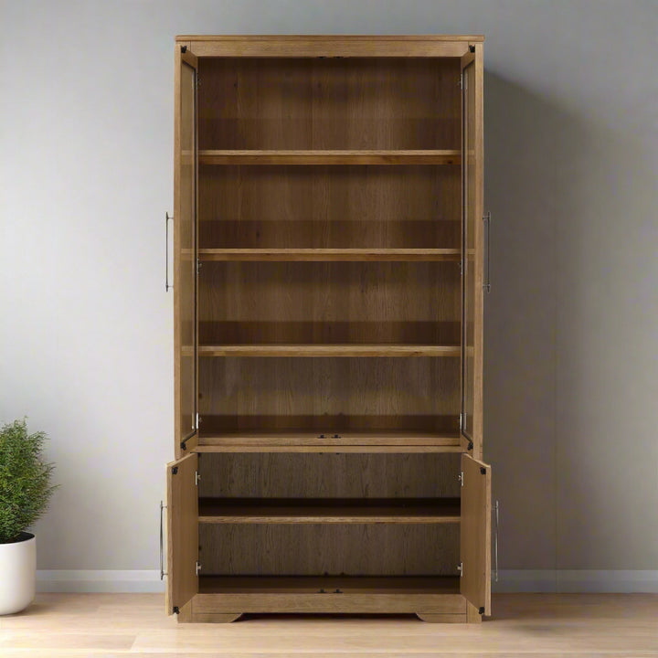 Wooden bookshelf with open doors on a white background