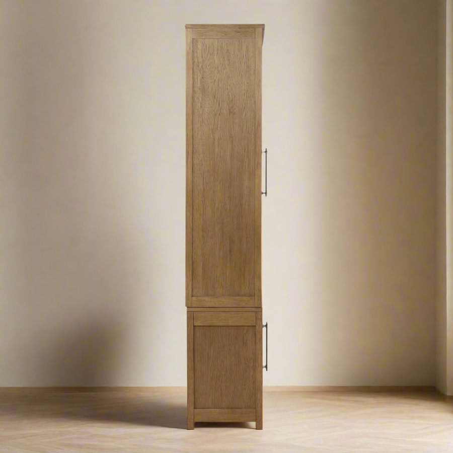 Tall wooden cabinet with two doors and two drawers on a white background