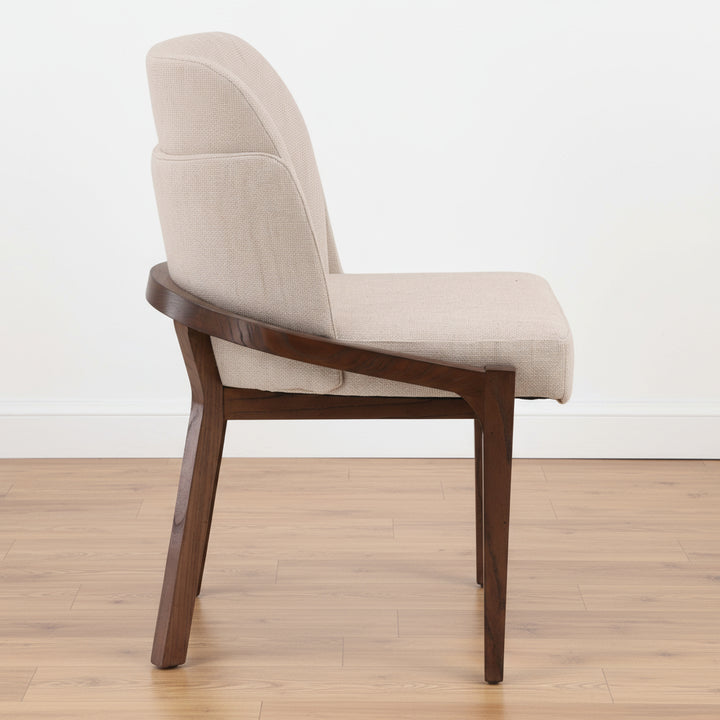 Beige upholstered chair with wooden legs
