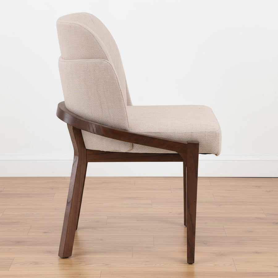 Beige upholstered chair with wooden legs