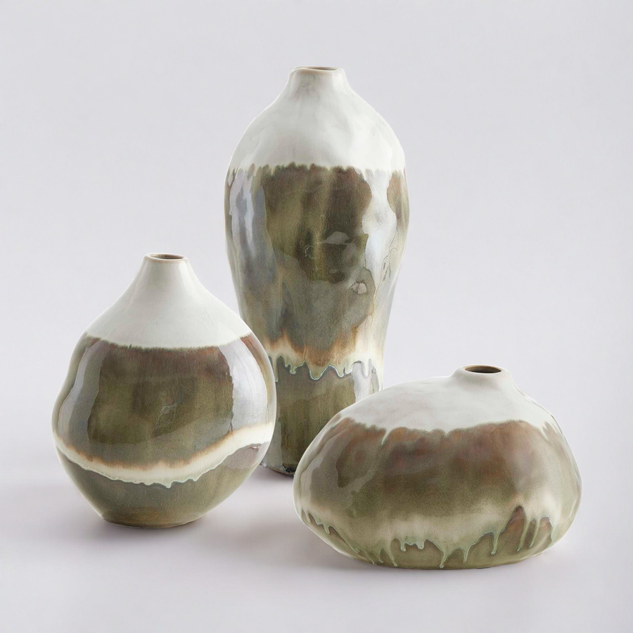 Three ceramic vases with brown and white glaze on a light gray background