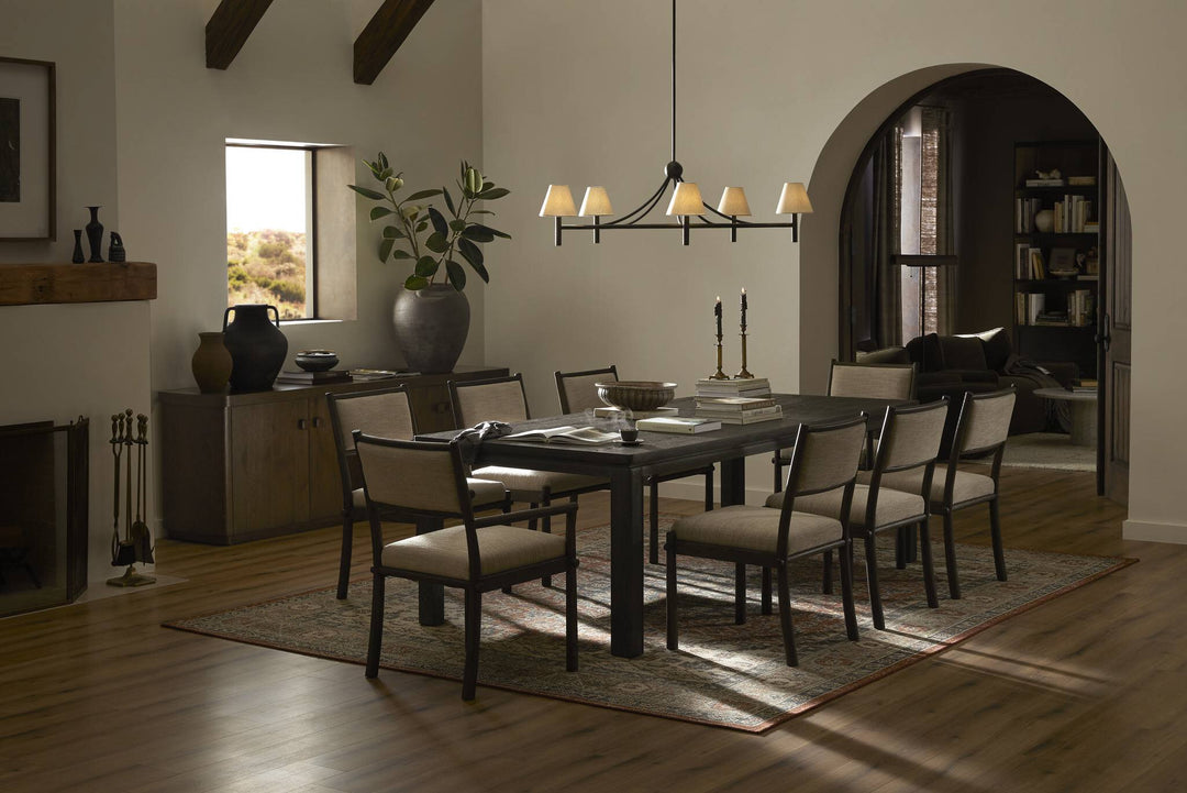 A modern dining table with a sleek wooden top and sturdy legs, designed for contemporary spaces.