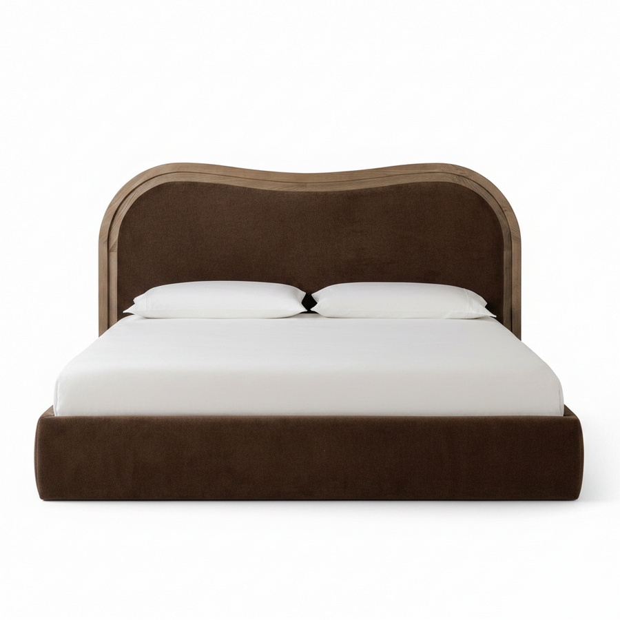 A modern platform bed with a wavy upholstered headboard in dark brown fabric and a light wood trim, shown with white bedding and two pillows on a solid white background.