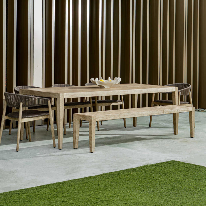 Wooden dining set with table and chairs on a patio
