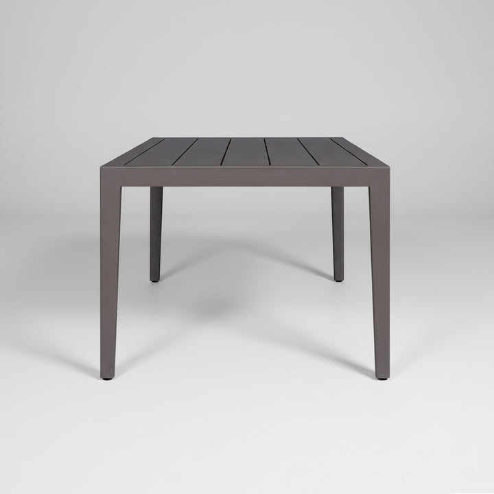 profile of a Rectangular table with a dark finish on a white background
