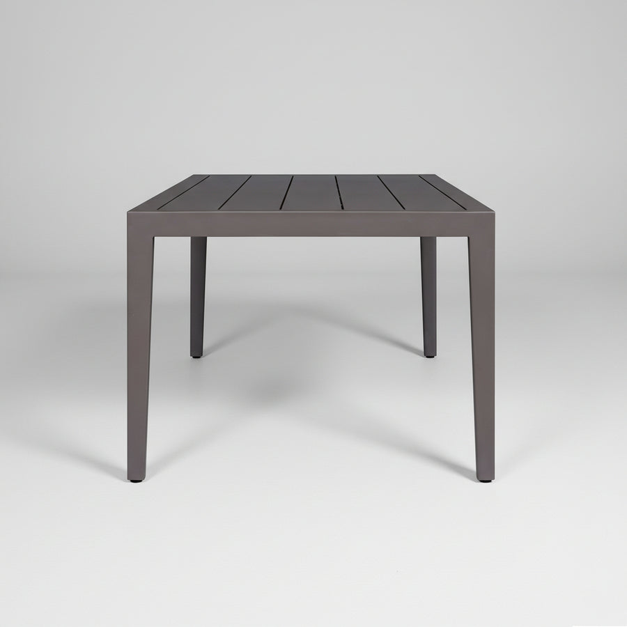 profile of a Rectangular table with a dark finish on a white background