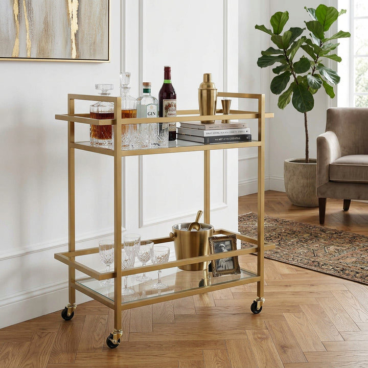 brushed gold serving cart with glass shelves