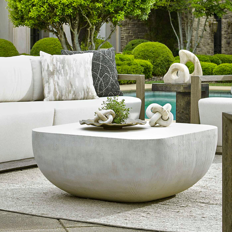coffee table with decorative items on a patio