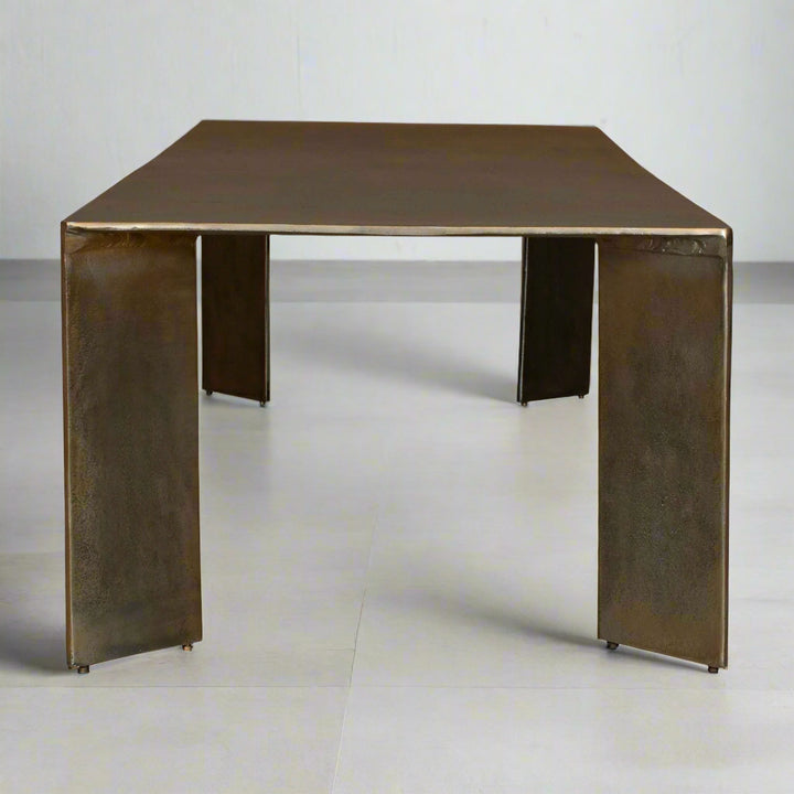 Bronze-colored square table on a white background