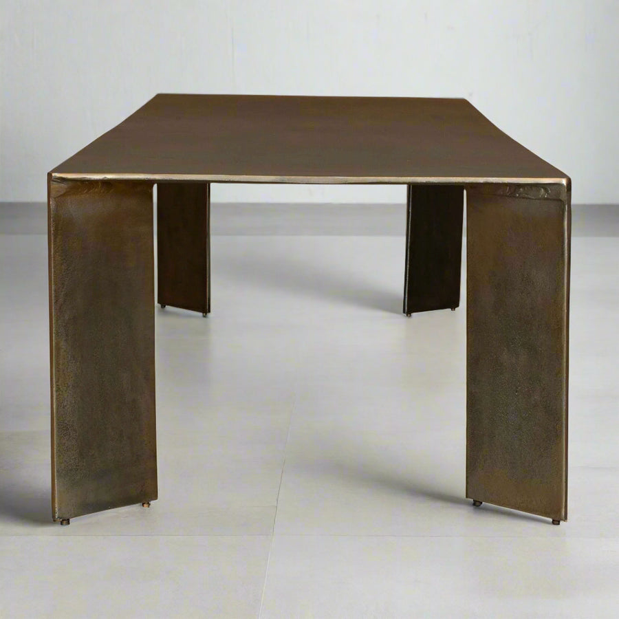 Bronze-colored square table on a white background