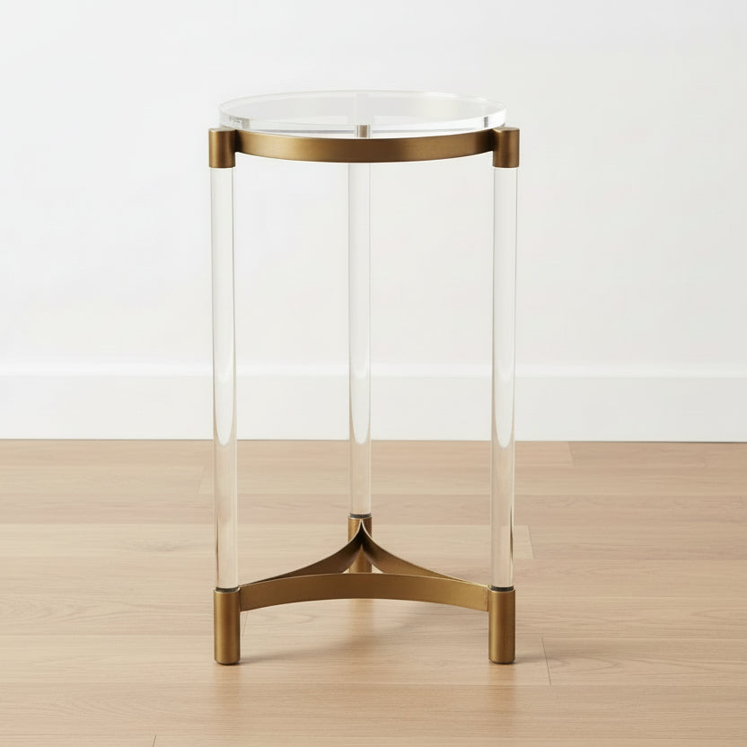 round clear acrylic tabletop, brass accents, clear acrylic legs, modern side table, minimalist design, sleek metallic base, contemporary furniture, clean lines, elegant aesthetic