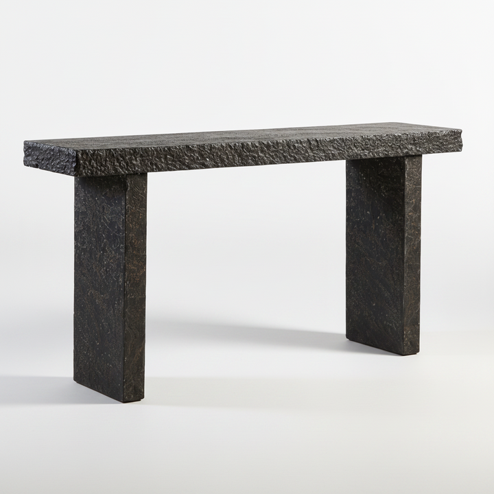 A dark gray stone console table with a textured rectangular top and two thick block legs, shown against a white studio background.