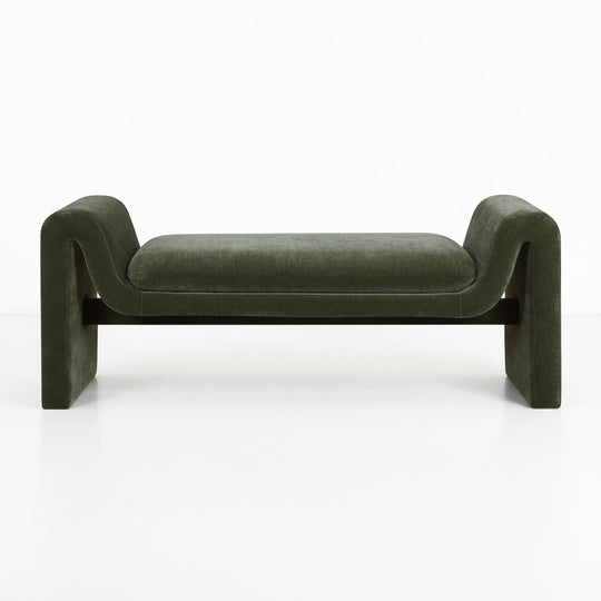 Green velvet bench with curved armrests