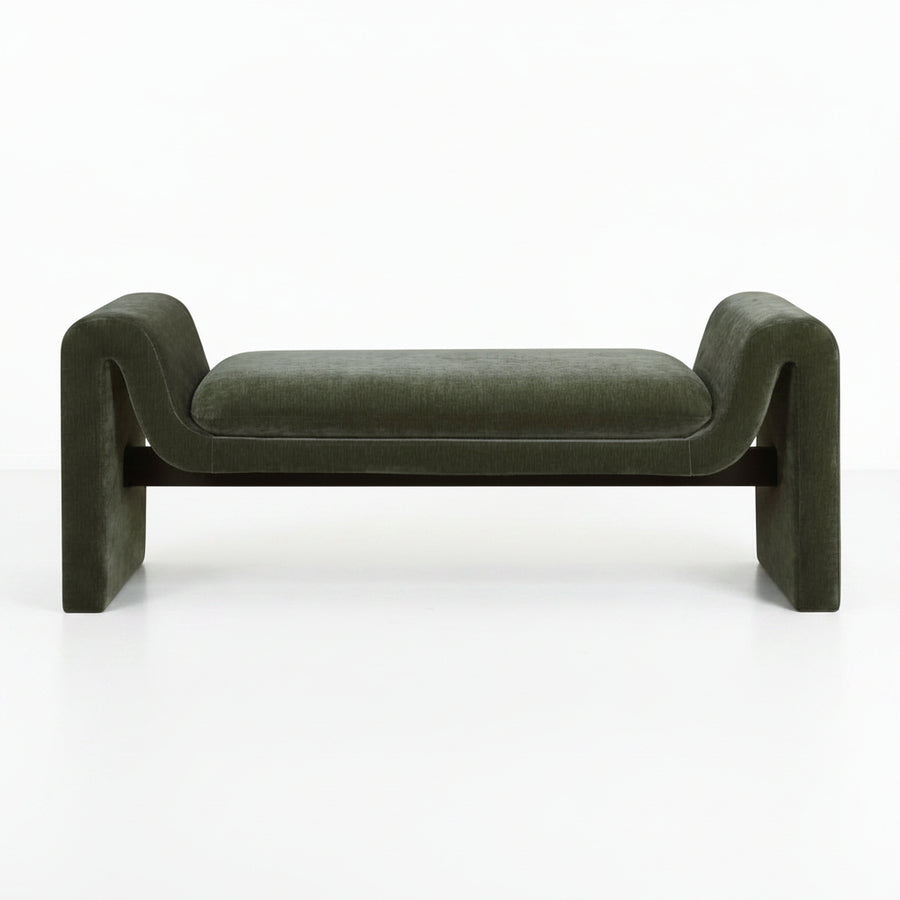 Green velvet bench with curved armrests