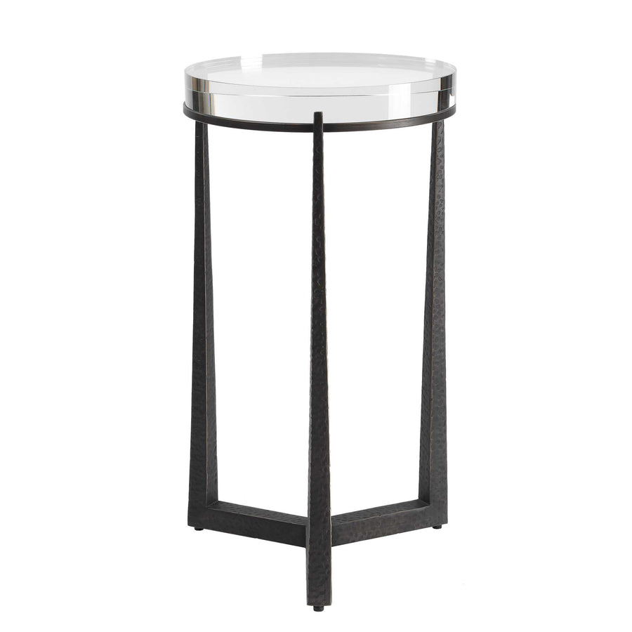 Small round side table with a clear glass top and black metal frame on a white background