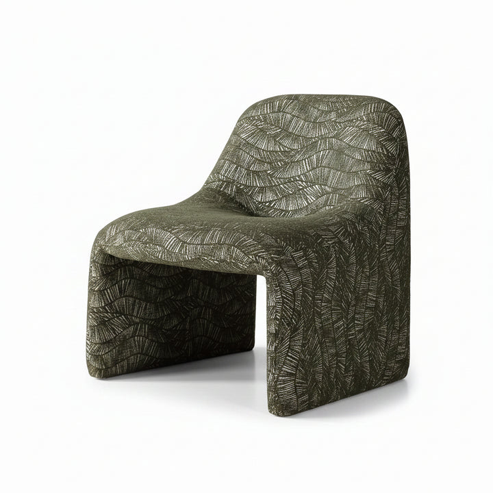 A sculptural molded chair upholstered in textured olive green fabric with a raised leaf-like pattern, shown on a clean white studio background.