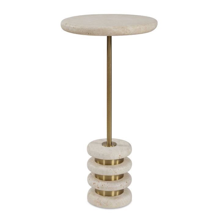 Small round travertine table with a brass base on a white background