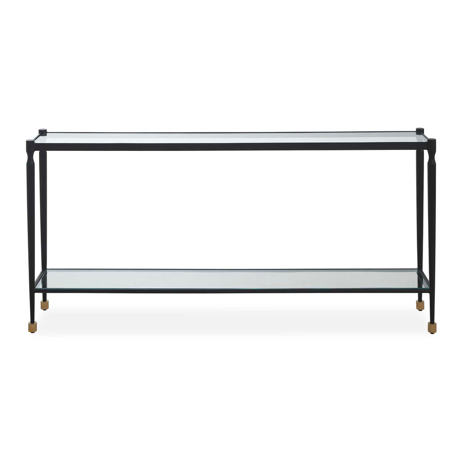 A metal console table with two clear glass shelves and small gold-toned feet, shown against a plain white background.