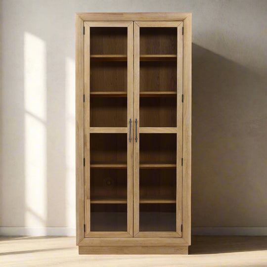 Wooden cabinet with glass doors on a white background
