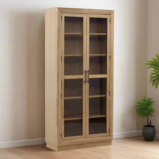 Wooden cabinet with glass doors on a white background