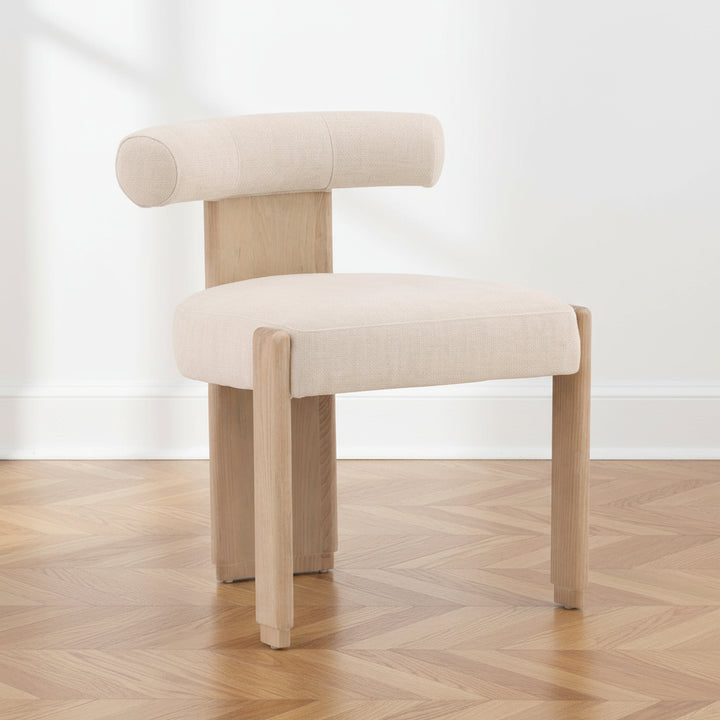 Beige chair with wooden legs on a white background