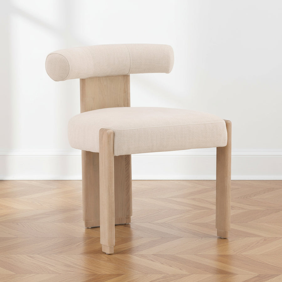 Beige chair with wooden legs on a white background