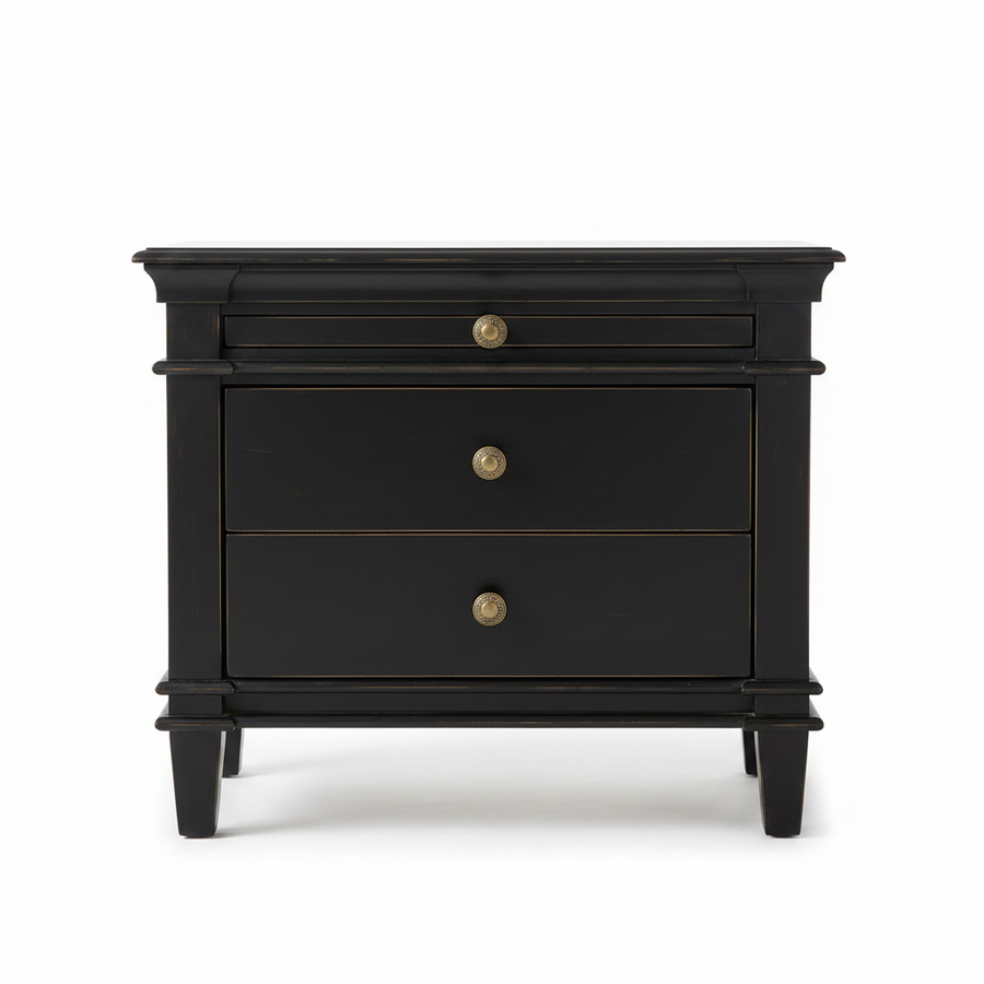 A black wooden nightstand with three drawers and brass knobs