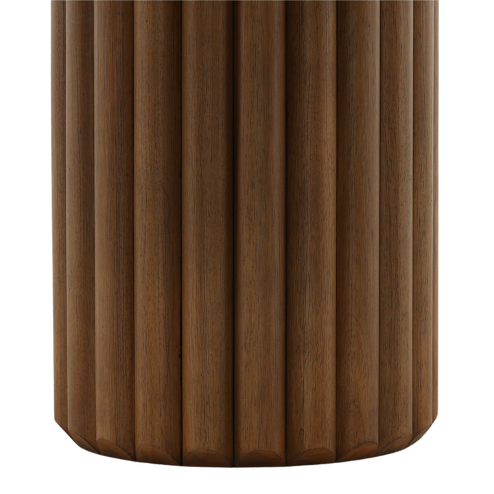 Wooden cylindrical object with a ribbed texture on a white background