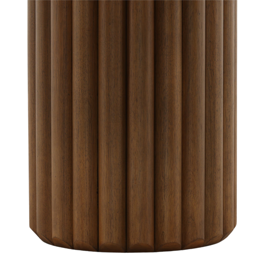 Wooden cylindrical object with a ribbed texture on a white background