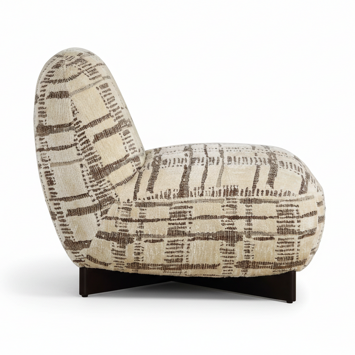 Patterned armchair on a white studio background