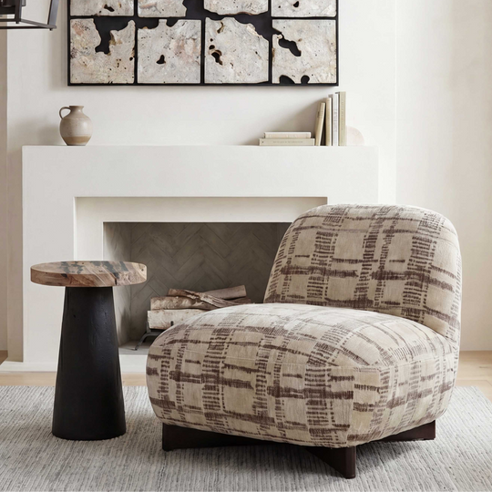A plush upholstered accent chair with a beige and brown plaid pattern
