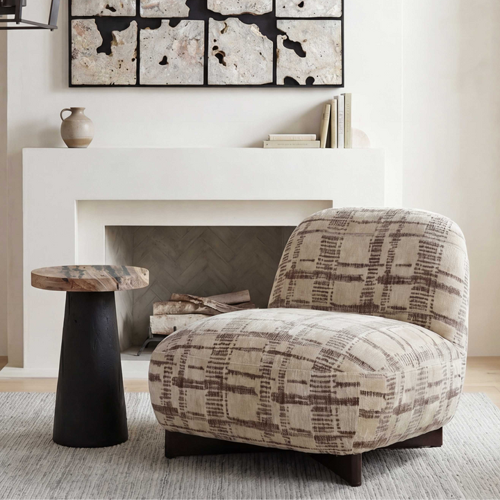 A plush upholstered accent chair with a beige and brown plaid pattern