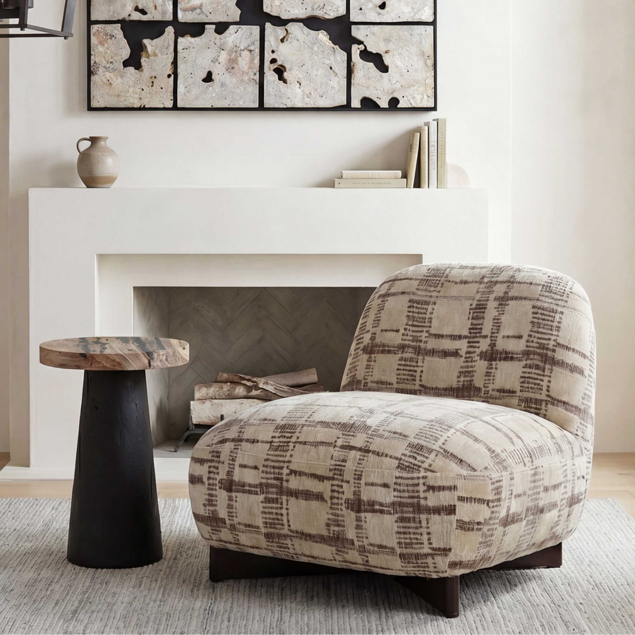 A plush upholstered accent chair with a beige and brown plaid pattern
