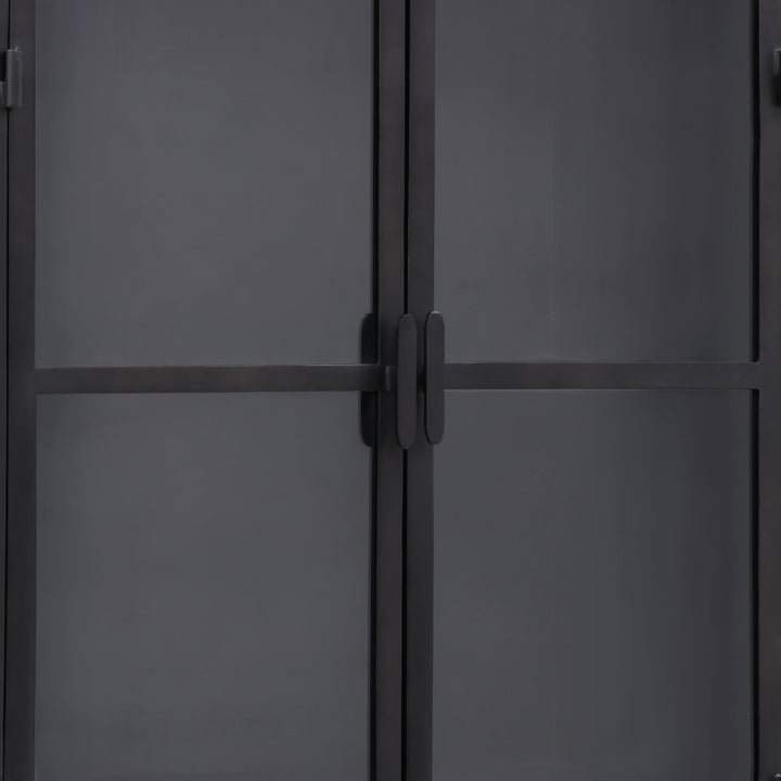 Close-up of a dark gray metal door with a handle
