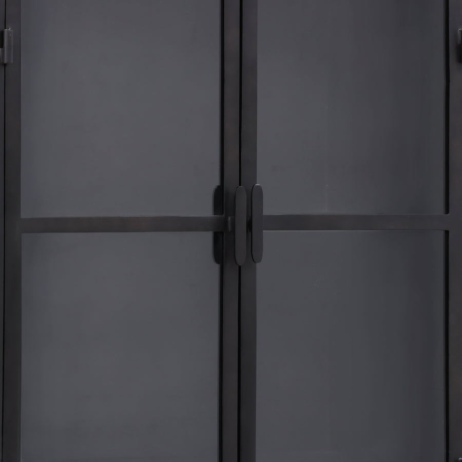 Close-up of a dark gray metal door with a handle