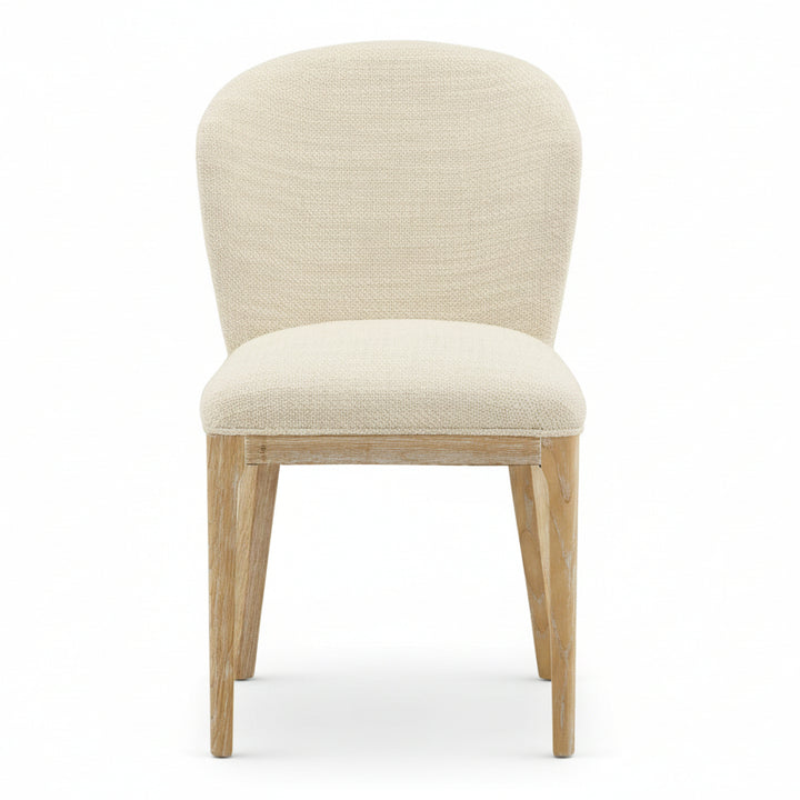 Beige upholstered chair with wooden legs on a white background